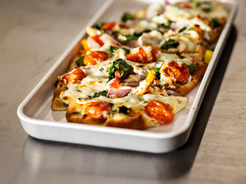 Freshly baked flatbread pizza with mozzarella cheese and bold toppings at 404 Sports Bar & Grill in Morrow, Georgia